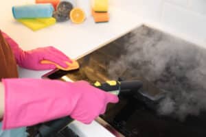 cleaning kitchen with steam vacuum